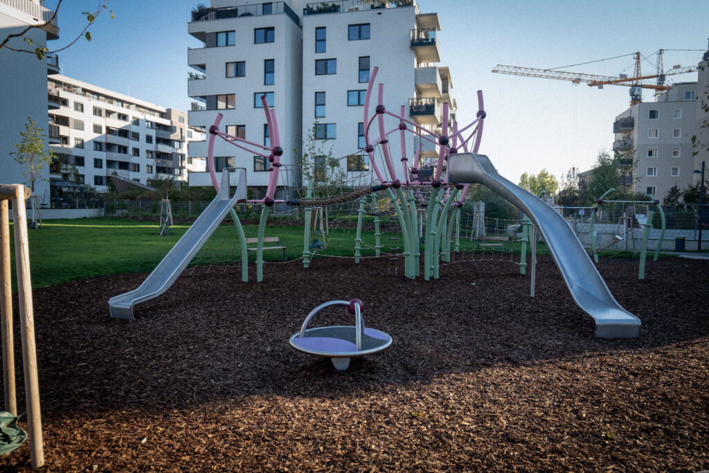 Overall view of the playground with crocus blossom climbing frame and slides
